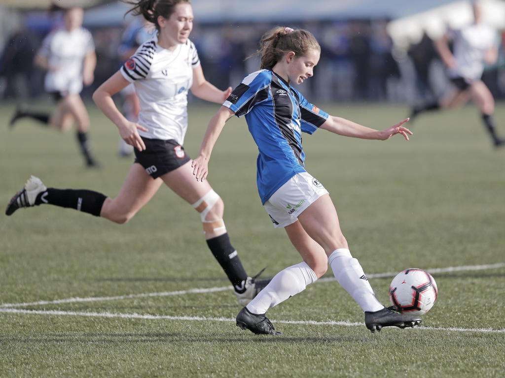 Hobart Zebras versus Kingborough Lions in the women's Statewide Cup final at KGV. Kingborough's Emille Tatton beats her opponent, Hobart's Rachel Gill, and crosses the ball into the box. Picture: PATRICK GEE