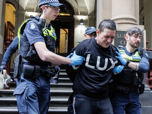 MELBOURNE, AUSTRALIA - NewsWire Photos - JUNE 13, 2024. A man was chased and pepper sprayed by police outside Melbourne Supreme Court. He was then taken away in a police van.  Picture: David Geraghty / NewsWire