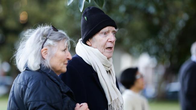 A man believed to be the owner of the house watches on as the firemen extinguish the blaze. Picture: Gaye Gerard