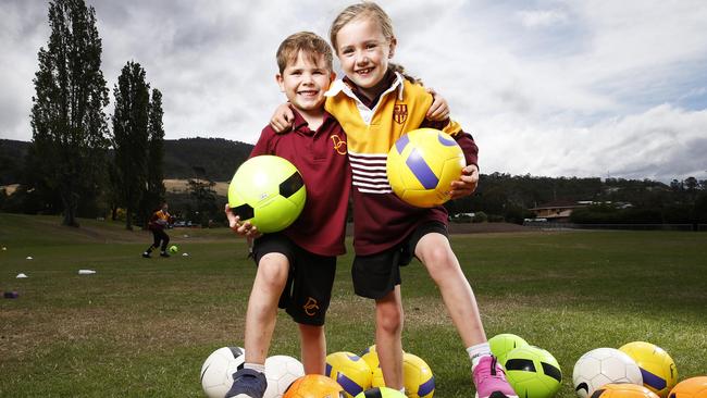 Dominic College grade 1 students Jameson King, 6 of Montrose and Charlotte Berry of Glenlusk are among a growing number of young Tasmanians playing soccer. Picture: ZAK SIMMONDS