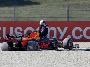 Verstappen leaves his car. (Photo by Luca Bruno / POOL / AFP)