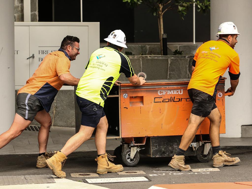 Workers leave the Probuild worksite on 443 Queen Street, Brisbane. Picture: Zak Simmonds