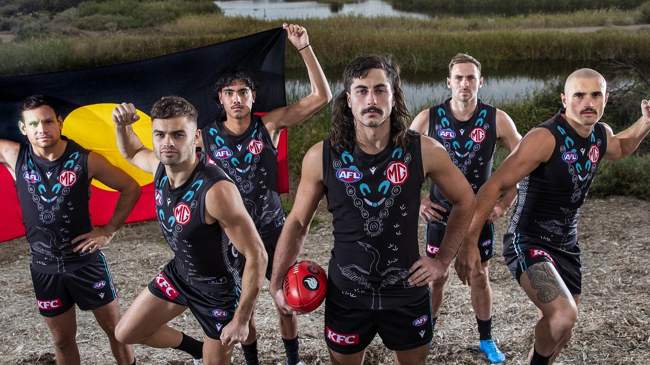 The Power players in their indigenous jumper. Designed by Lachie Jones. (Photo by Sarah Reed/AFL Photos/via Getty Images)