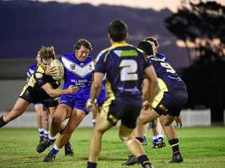 READY FOR FINALS: Wallaroos' Beaudyn McMahon tries to force his way through the Waves in Saturday's loss. Picture: Brian Cassidy