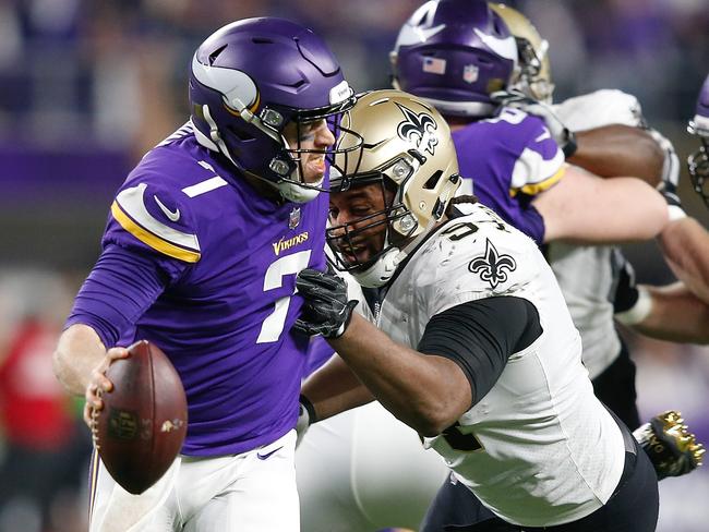 Case Keenum tries to escape pressure from Cameron Jordan.