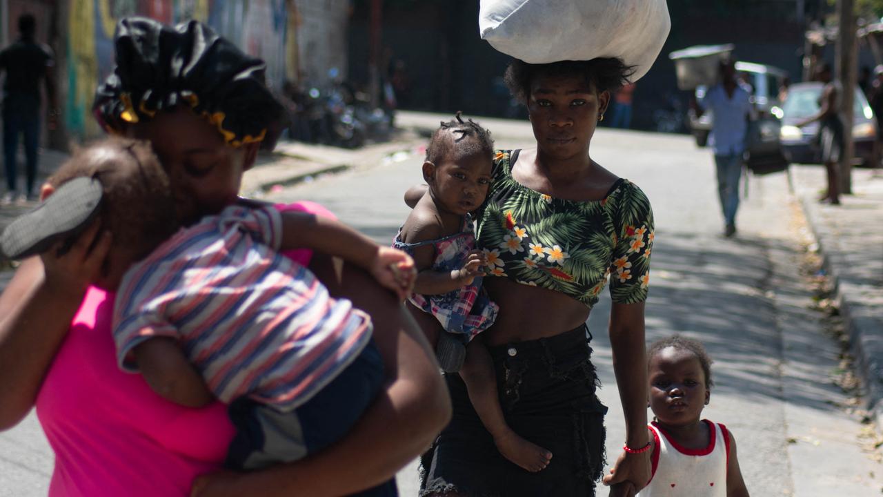 Residents leave their homes as gang violence escalates. Picture: Clarens Siffroy/AFP