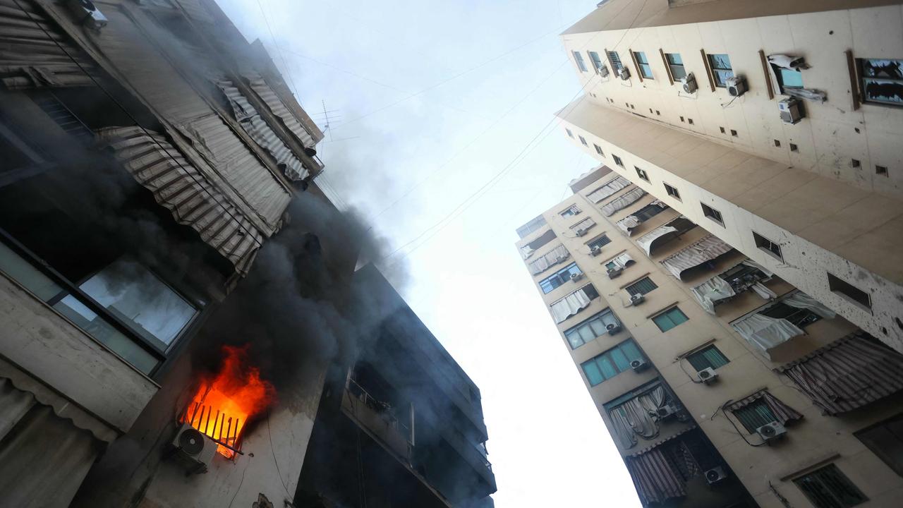 A fire burns in a damaged building at the site of overnight Israeli airstrikes on the Chiah neighbourhood in Beirut's southern suburbs on October 4, 2024. Picture: AFP.