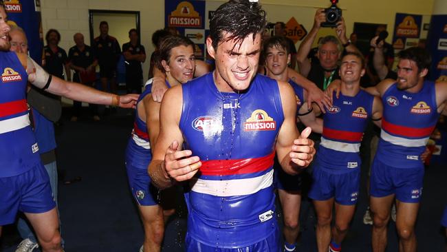 Tom Boyd in the middle of the circle after his first win with the Bulldogs. Picture: Michael Klein