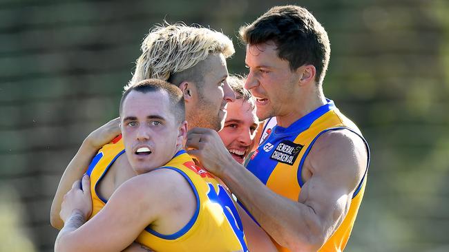 Shane Doherty of Macleod is congratulated by team mates after kicking a goal during the round three NFNL Division 1 Melbourne Greyhounds Seniors match between West Preston-Lakeside and Macleod at JE Moore Park Oval, on April 27, 2024, in Melbourne, Australia. (Photo by Josh Chadwick)