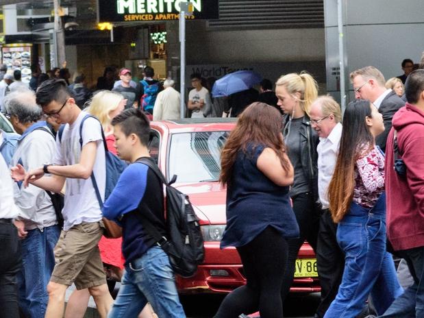 People crowd crossing street in central Sydney. . Picture: iStock
