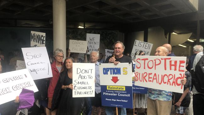 Ratepayers protesting at the January meeting of Northern Beaches Council where it voted to pursue at 40pc rate rise over the next three years. Picture: Jim O’Rourke