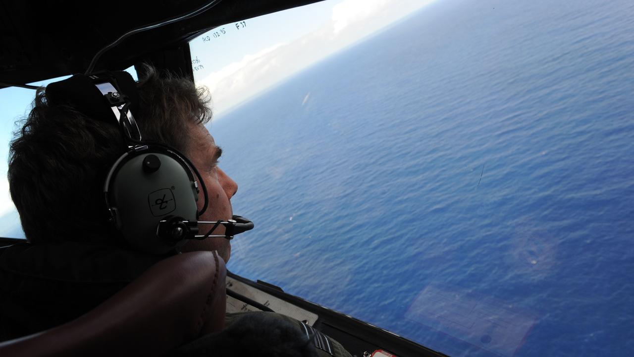 Royal New Zealand Airforce (RNZAF) Squadron Leader Brett McKenzie in a P-3K2-Orion aircraft in 2014 helping to look for objects during the search for missing Malaysia Airlines flight MH370, off Perth. Picture: AFP