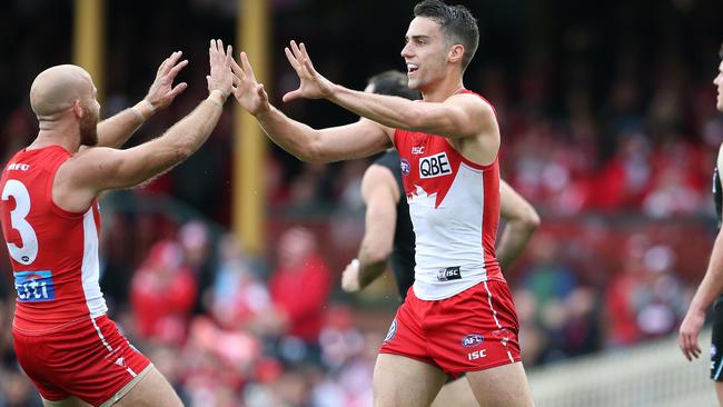 Xavier Richards with Jarrad McVeigh. (AAP Image/David Moir).