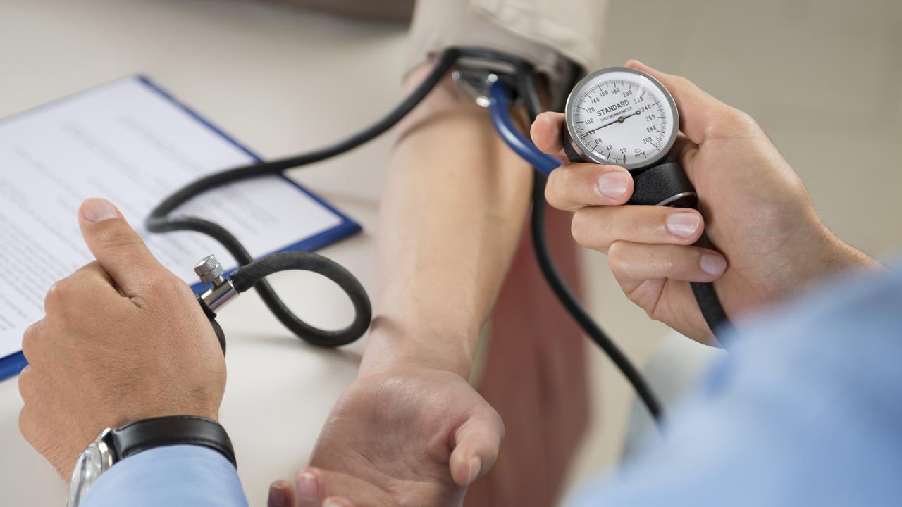 Doctor Measures Pressure In The Patient