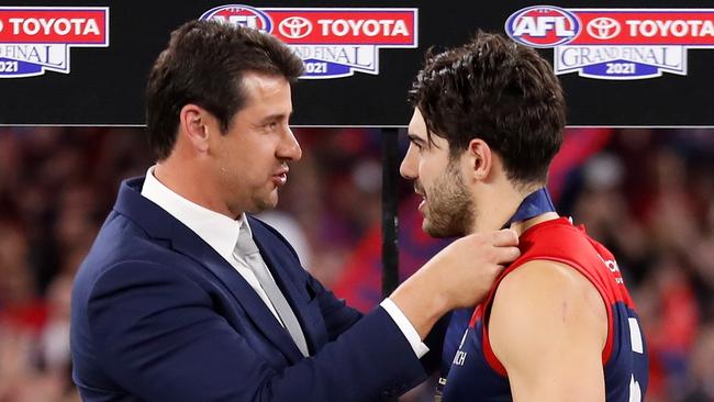 PERTH, AUSTRALIA - SEPTEMBER 25: Andrew Embley presents Christian Petracca of the Demons with the Norm Smith Medal during the 2021 Toyota AFL Grand Final match between the Melbourne Demons and the Western Bulldogs at Optus Stadium on September 25, 2021 in Perth, Australia. (Photo by Michael Willson/AFL Photos via Getty Images)