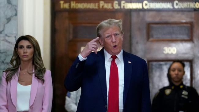 Former US President Donald Trump speaks to members of the media as he arrives at the New York State Supreme Court during the civil fraud trial against the Trump Organization, in New York City on December 7, 2023. Picture: Timothy A. Clary/AFP