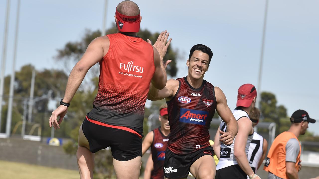 Tom Bellchambers and Dylan Shiel share a high-five, with the ruckman to blame for Shiel’s new nickname. Picture: Alan Barber