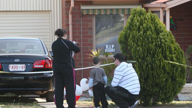 Grieving relatives leave tributes to Beverley Hanley at the crime scene after her body was discovered in her Elizabeth North home.