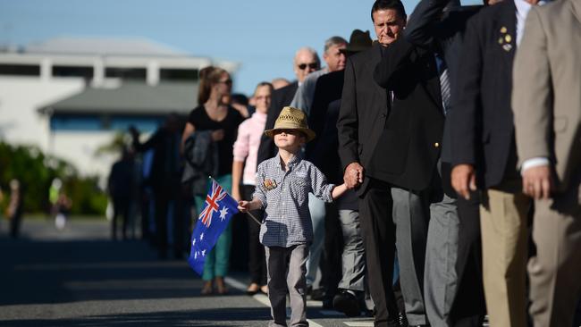 Chermside ANZAC day at Kedron Wavell RSL. Noah Puusaari, 5 of Bridgeman Downs walking with Grandfather John Hope