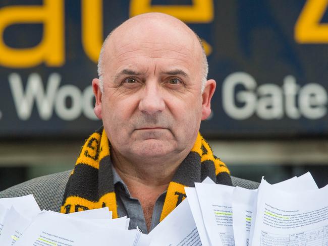 Richmond fan Dr Joe Garra and anothera petition of almost 900 names (from around 1200) asking the Tigers not to strip seats from fans. Picture: Jason Edwards