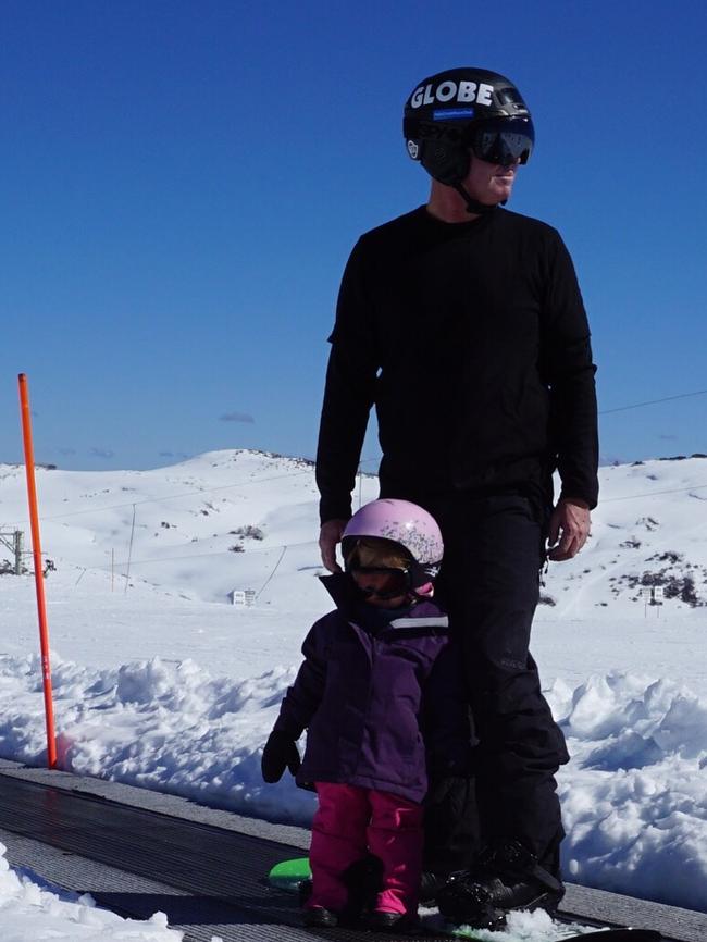 Former professional snowboarder David Thorpe with daughter Evie, 3, at Falls Creek. Picture: Supplied.