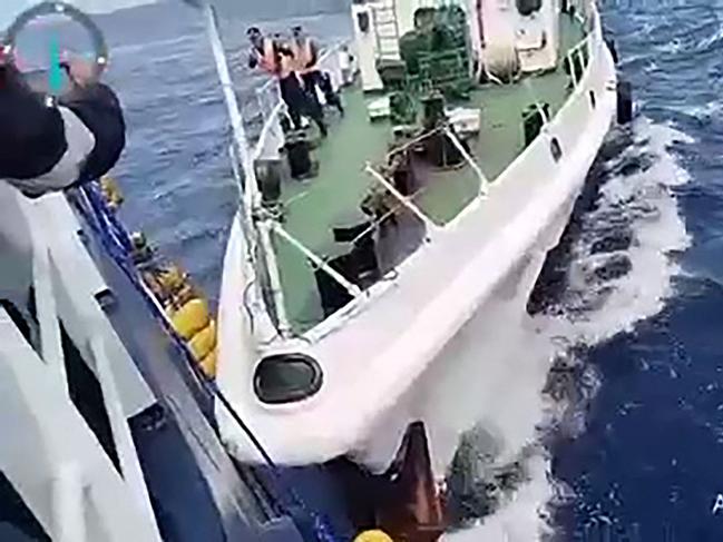 TOPSHOT - This frame grab from handout video footage taken and released on August 25, 2024 by the Philippine Coast Guard (PCG) shows a Chinese coast Guard ship (R) in a collision with the Philippine Bureau of Fisheries and Aquatic Resources (BFAR) vessel BRP Datu Sanday, near Sabina Shoal in disputed waters of the South China Sea. China's coast guard said it rescued Filipino "personnel" who fell overboard August 25 after a Philippine vessel collided with one of its ships near a disputed shoal in the South China Sea, while the Philippine government accused Chinese vessels of ramming and using water cannon against its ship. (Photo by Handout / Philippine Coast Guard (PCG) / AFP) / -----EDITORS NOTE --- RESTRICTED TO EDITORIAL USE - MANDATORY CREDIT "AFP PHOTO / PHILIPPINE COAST GUARD (PCG) " - NO MARKETING - NO ADVERTISING CAMPAIGNS - DISTRIBUTED AS A SERVICE TO CLIENTS