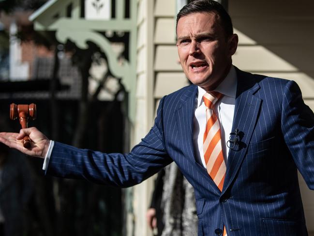 SYDNEY, AUSTRALIA - August 22: Auctioneer Damien Cooley holding the auction of 7 Third Avenue, Epping. The house was auctioned with no reserve and sold for $1,871,000. (Photo by James Gourley/The Sunday Telegraph)