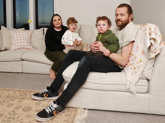 Amy, Ella, Lemmy and Brad. Amy Lee and Brad Eagland built a two storey house in Armstrong Creek, prioritising interior space over a backyard. Picture: Alan Barber