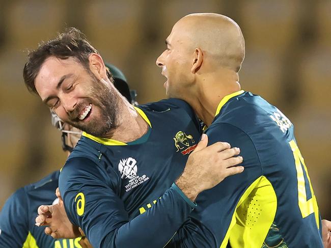 GROS ISLET, SAINT LUCIA - JUNE 15: Ashton Agar of Australia celebrates with teammate Glenn Maxwell after bowling Michael Jones of Scotland (not pictured) the ICC Men's T20 Cricket World Cup West Indies & USA 2024 match between Australia and Scotland at Daren Sammy National Cricket Stadium on June 15, 2024 in Gros Islet, Saint Lucia. (Photo by Robert Cianflone/Getty Images)