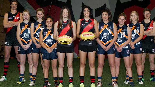 Essendon Football Club players Joe Daniher (far left) and Zach Merrett (far right) with prospective Essendon AFLW players. Shenay Thomas, Georgia Marsland, Chey Macumber, Georgia Patrikios, Stephanie Elias, Jacinta Taylor, Molly Hemburrow and Kellie Sutton. Picture: Ben Johnstone