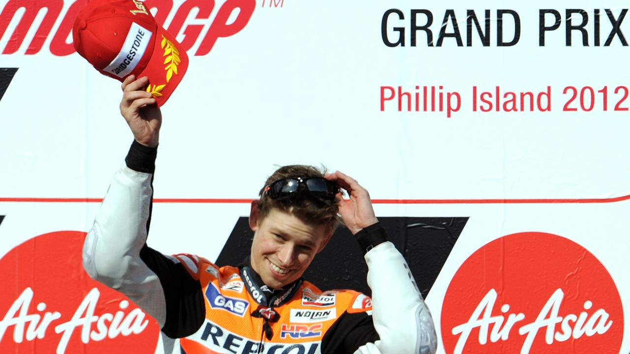 Casey Stoner of Australia saluyes his fans after the 2012 Australian MotoGP at Phillip Island.