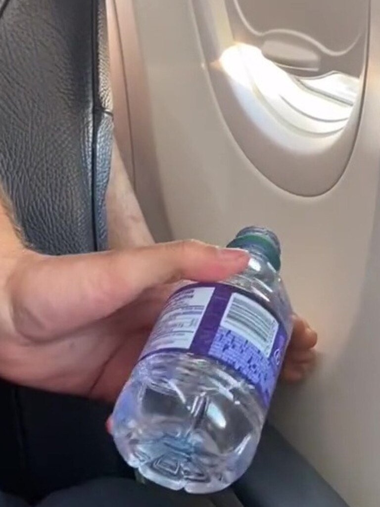 He then pours a bit of water onto the feet