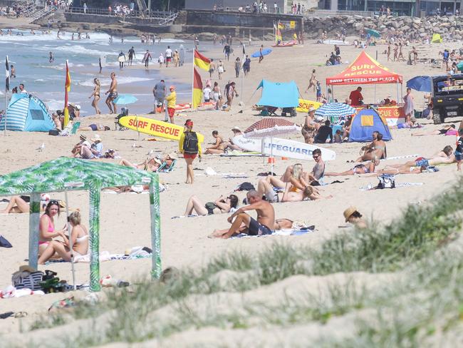 Pictures of people on Sydney beaches (Cronulla, above) several weeks ago drew criticism from around the world. Were too many people placing too much faith in the therapeutic properties of sunlight? Picture: Matrix Media Group