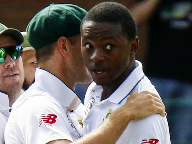 FILE -- In this March 9, 2018 file photo South Africa's bowler Kagiso Rabada, second right, celebrates a wicket with team mates during the second cricket test match between South Africa and Australia at St George's Park in Port Elizabeth, South Africa, Rabada has been banned for the rest of the series against Australia after being found guilty of two charges of misconduct for aggressive wicket celebrations. (AP Photo/Michael Sheehan, File)