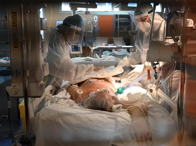 Medical workers in Rome tend to a patient in the COVID Intensive Care Unit on October 22. Picture: AFP