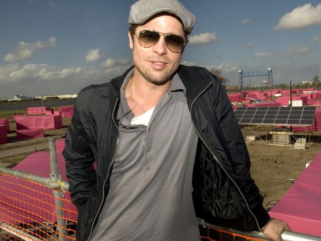 US actor Brad Pitt is pictured in 2007 before pink stand-in structures where 150 ecologically sustainable homes are to be built. Picture: AFP PHOTO/Matthew Hinton.