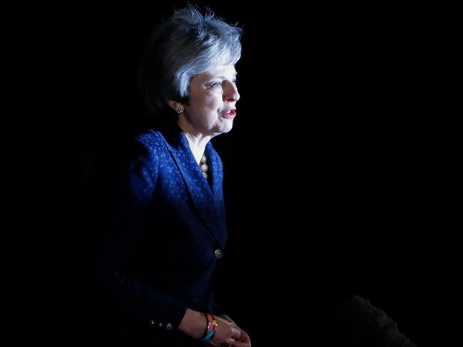 Britain's Prime Minister Theresa May makes a statement outside 10 Downing Street in central London after winning a confidence vote on December 12, 2018. (Photo by Tolga AKMEN / AFP)