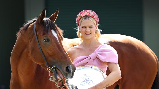 Olympic swimmer Shayna Jack cuddles up with Cox Plate fancy Docklands. Picture: David Caird