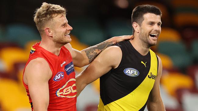 Teammates turned rivals Brandon Ellis and Trent Cotchin clash in Round 12. Picture: Michael Klein