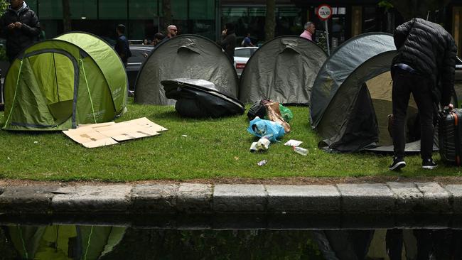 Asylum seekers sleeping rough in tents in Dublin say life under tarpaulin cover is better and safer than facing the risk of being deported by the UK to Rwanda. Picture: AFP.