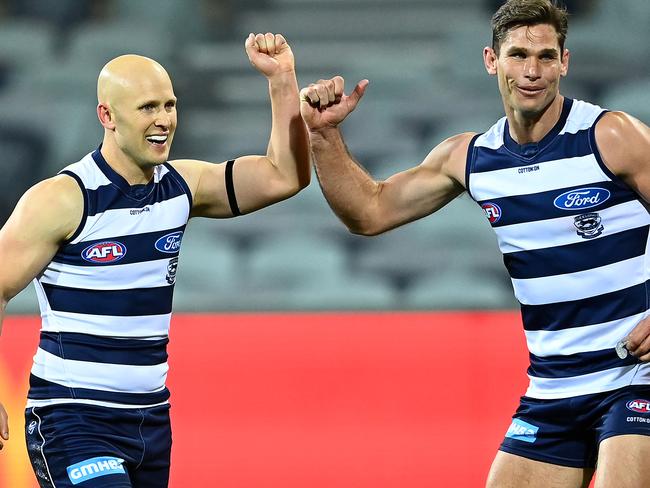 GEELONG, AUSTRALIA - JUNE 12: Gary Ablett of the Cats is congratulated by Tom Hawkins after kicking a goal during the round 2 AFL match between the Geelong Cats and the Hawthorn Hawks at GMHBA Stadium on June 12, 2020 in Geelong, Australia. (Photo by Quinn Rooney/Getty Images)