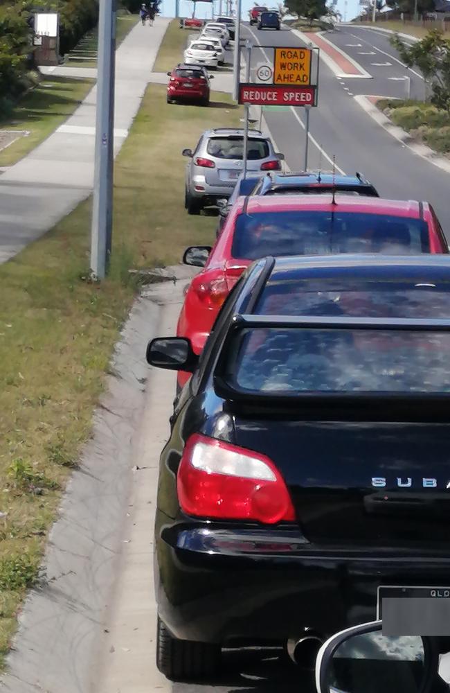 Parked cars on Alma Road, Dakabin, near two large townhouse complexes. Photo: David Alexander