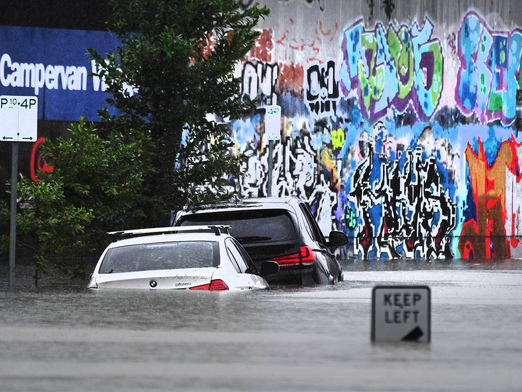 Flooding in Longland St, East Brisbane, on Sunday. Picture: John Gass