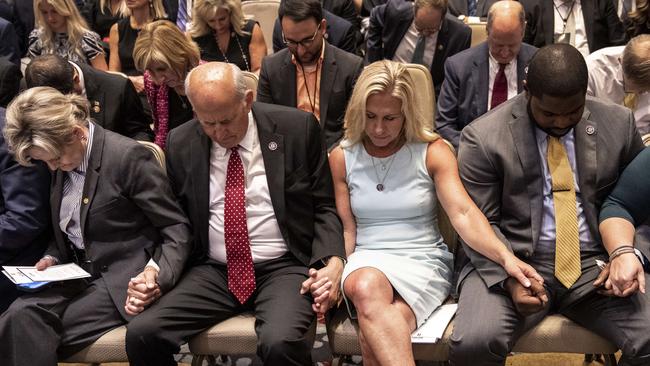 Republicans pray at the America First Agenda Summit. Picture; AFP.