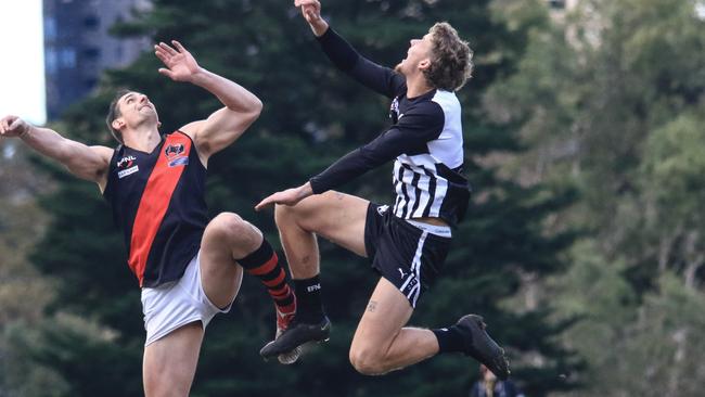 Kilsyth ruckman Sean Currey (left) in full flight on Saturday. Picture: Davis Harrigan