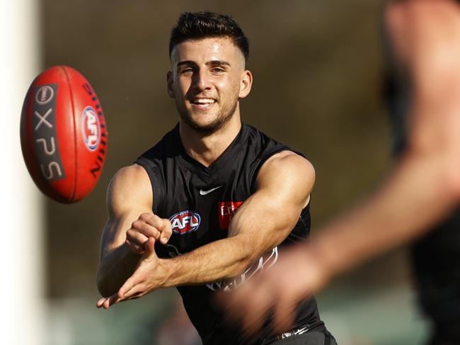 MELBOURNE, AUSTRALIA - SEPTEMBER 15: Nick Daicos of the Magpies handballs during a Collingwood Magpies AFL training session at Olympic Park Oval on September 15, 2023 in Melbourne, Australia. (Photo by Darrian Traynor/Getty Images)