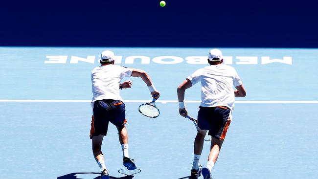 Bob and Mike Bryan set off for a ball during their doubles match on Rod Laver Arena. Picture: Getty