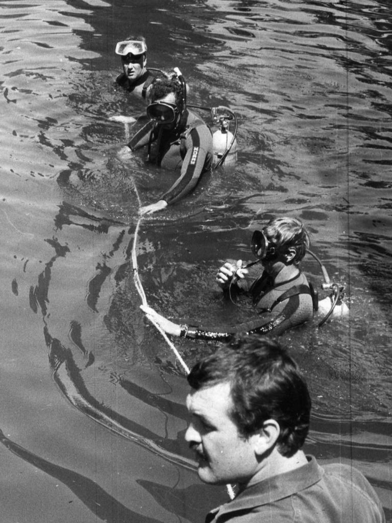 SA Police divers look for Mark Langley.