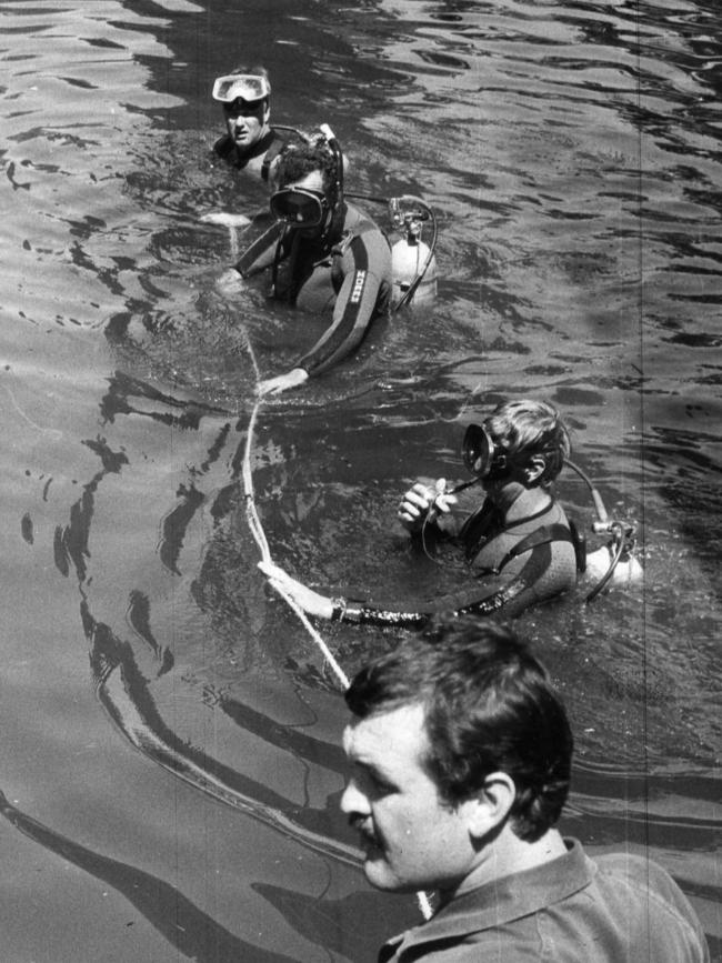 SA Police divers look for Mark Langley.