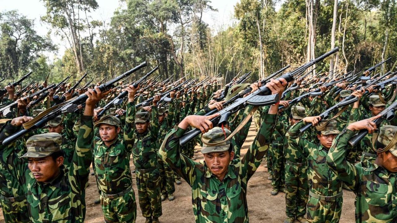 Members of the ethnic rebel group Ta’ang National Liberation Army (TNLA) take part in a training exercise at their base camp in the forest in Myanmar’s northern Shan State